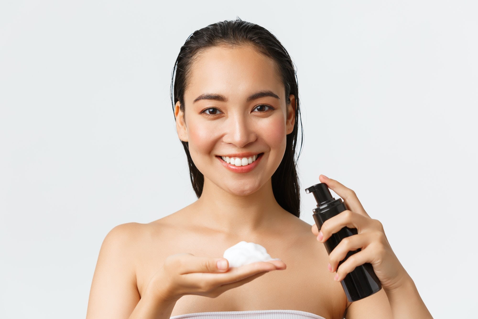 Skincare, women beauty, hygiene and personal care concept. Close-up of beautiful smiling asian woman