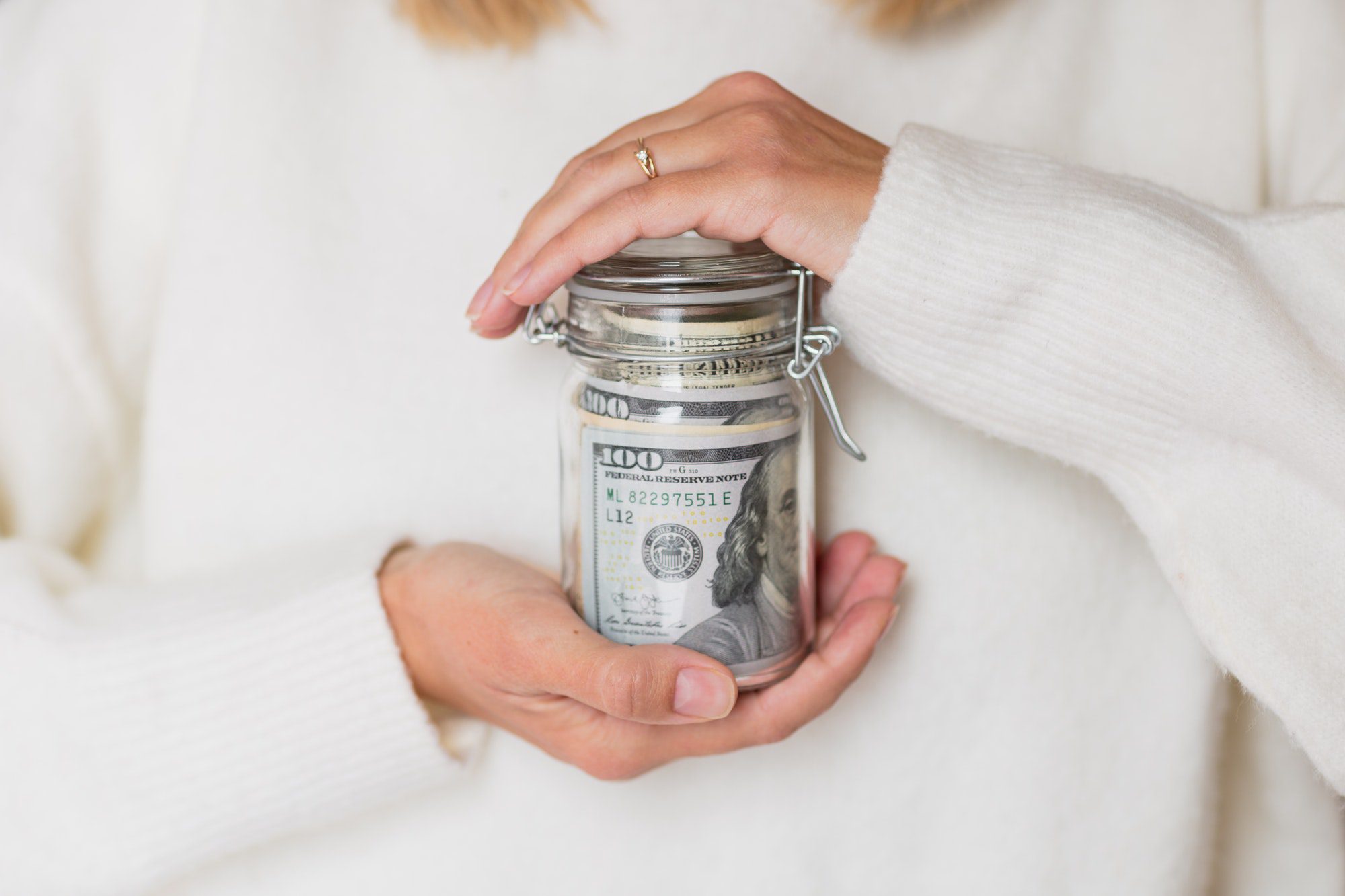 Woman Holding Hands Glass Bank With Cash Money