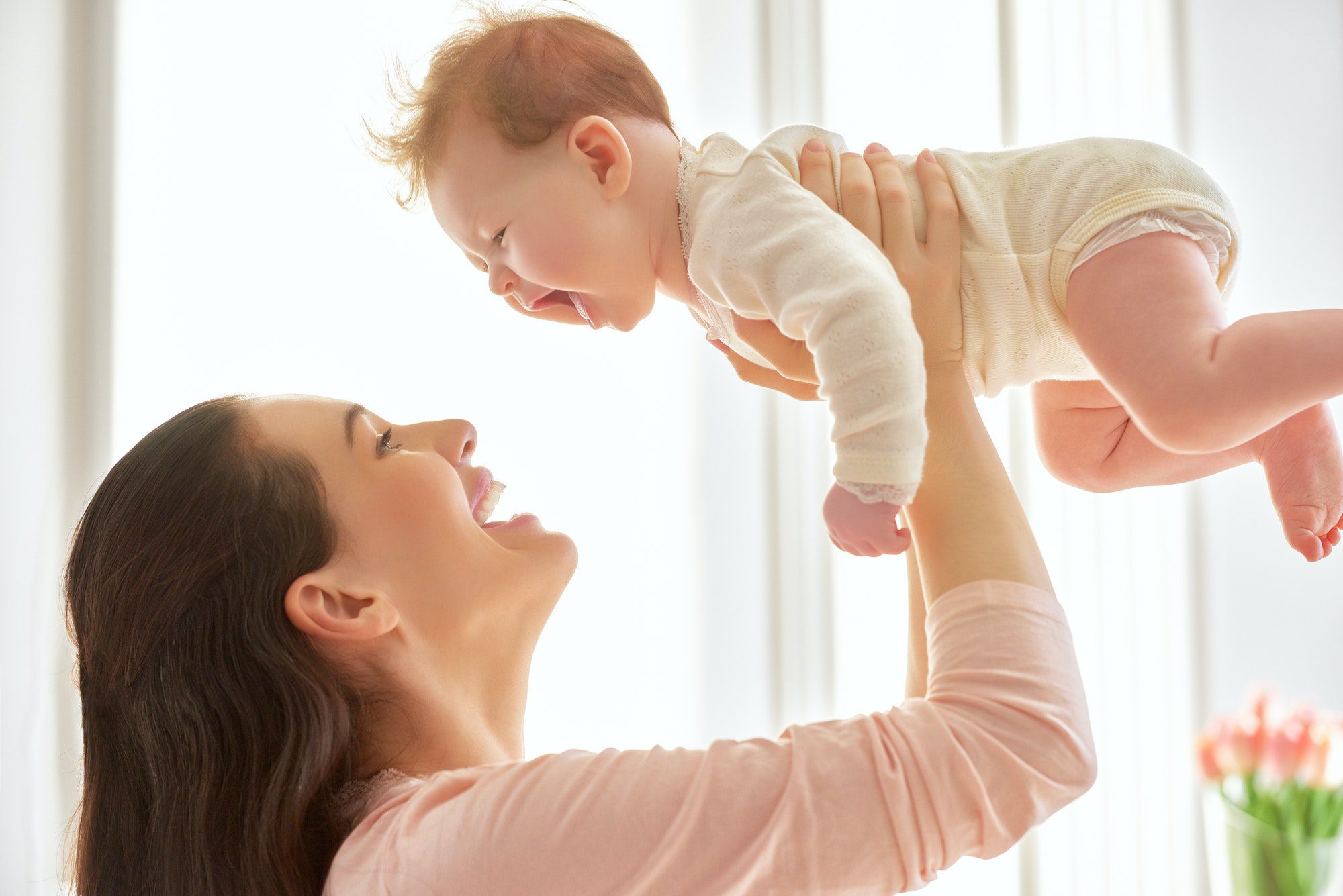 mother playing with her baby