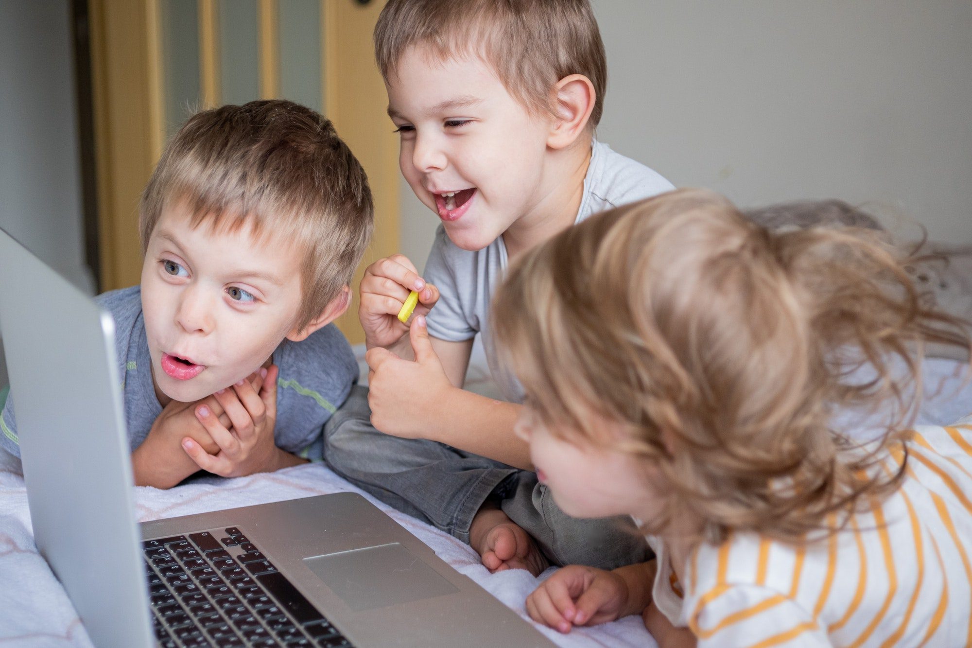 Little kids with laptop. Brothers and sister. Kids with technology