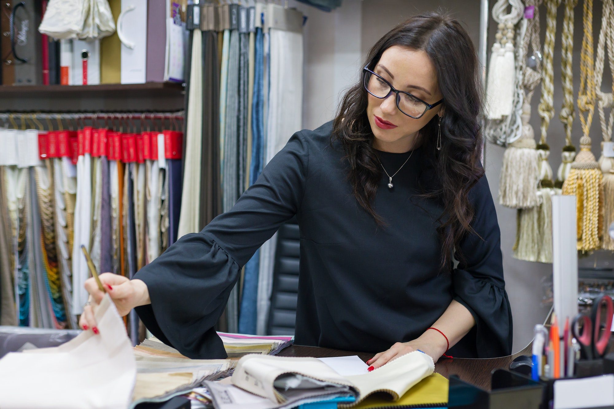 Woman owns a store of interior fabrics and decor