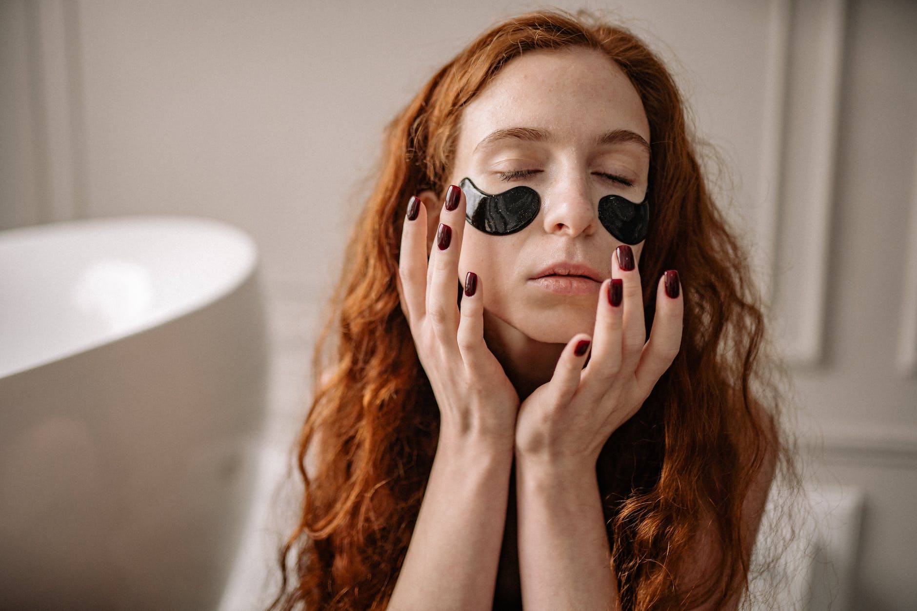 a woman with under eye patches