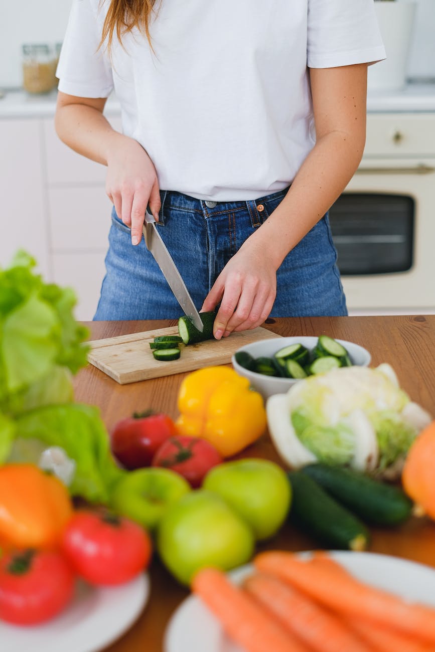 cutting cucumber on board